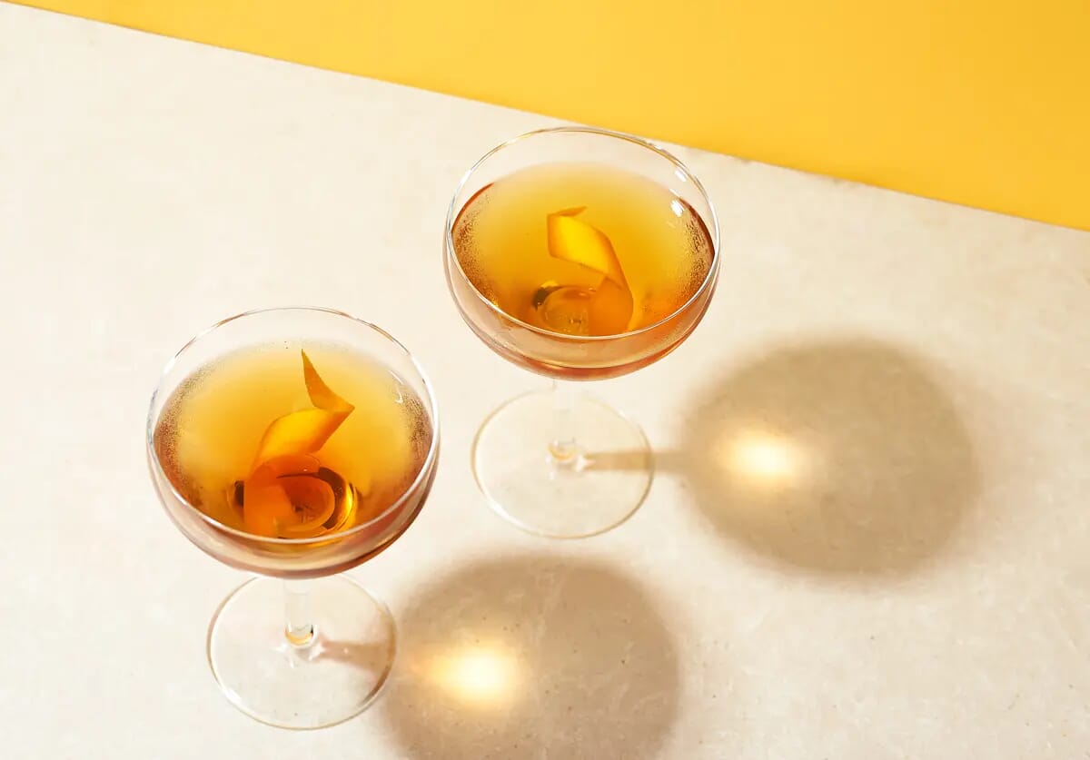Americano cocktail with lemon garnish and long shadows adverising creative photography london